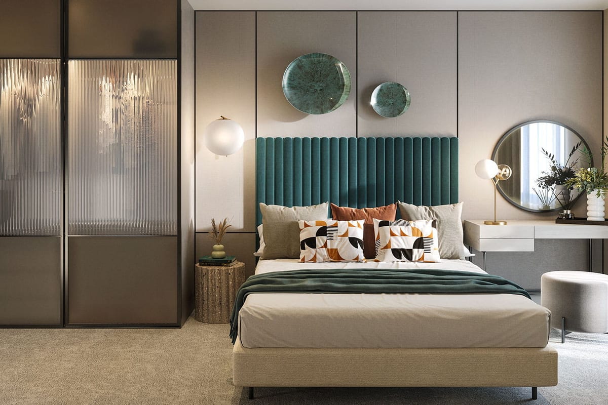 Show apartment bedroom with a channelled teal headboard, a round mirror and a glazed sliding wardrobe