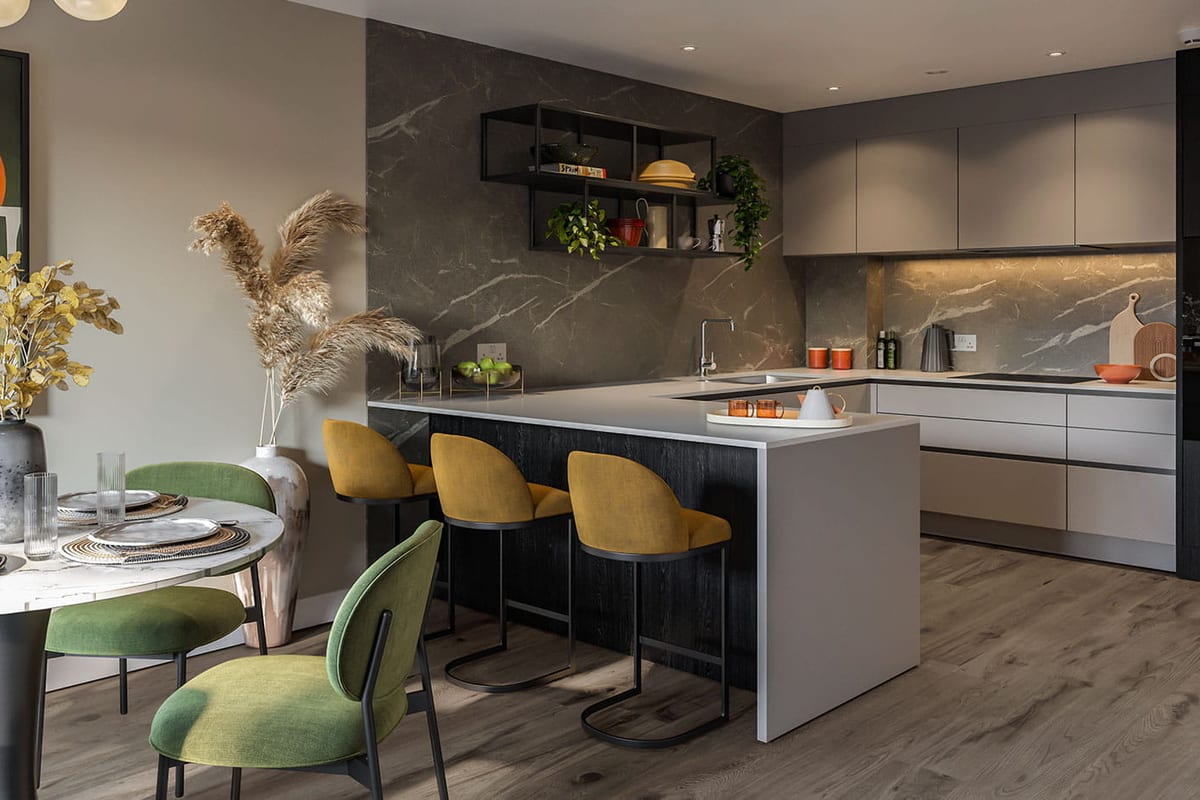 Show apartment kitchen with a dark marble-effect splashback and an island with mustard stools